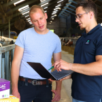 Farmer and AHV Advisor Checking StopLac Data